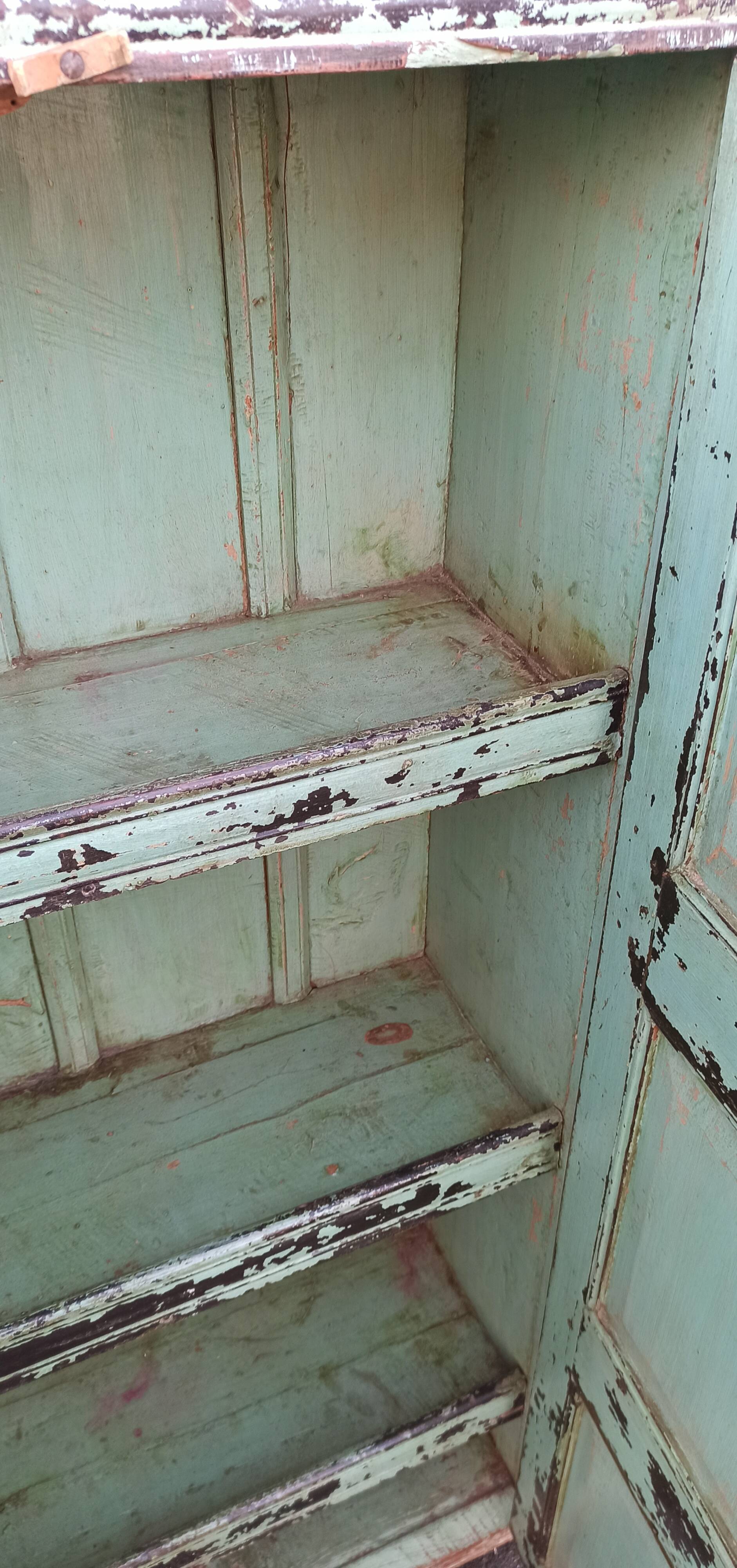 Old wooden cabinet with beautiful green patina