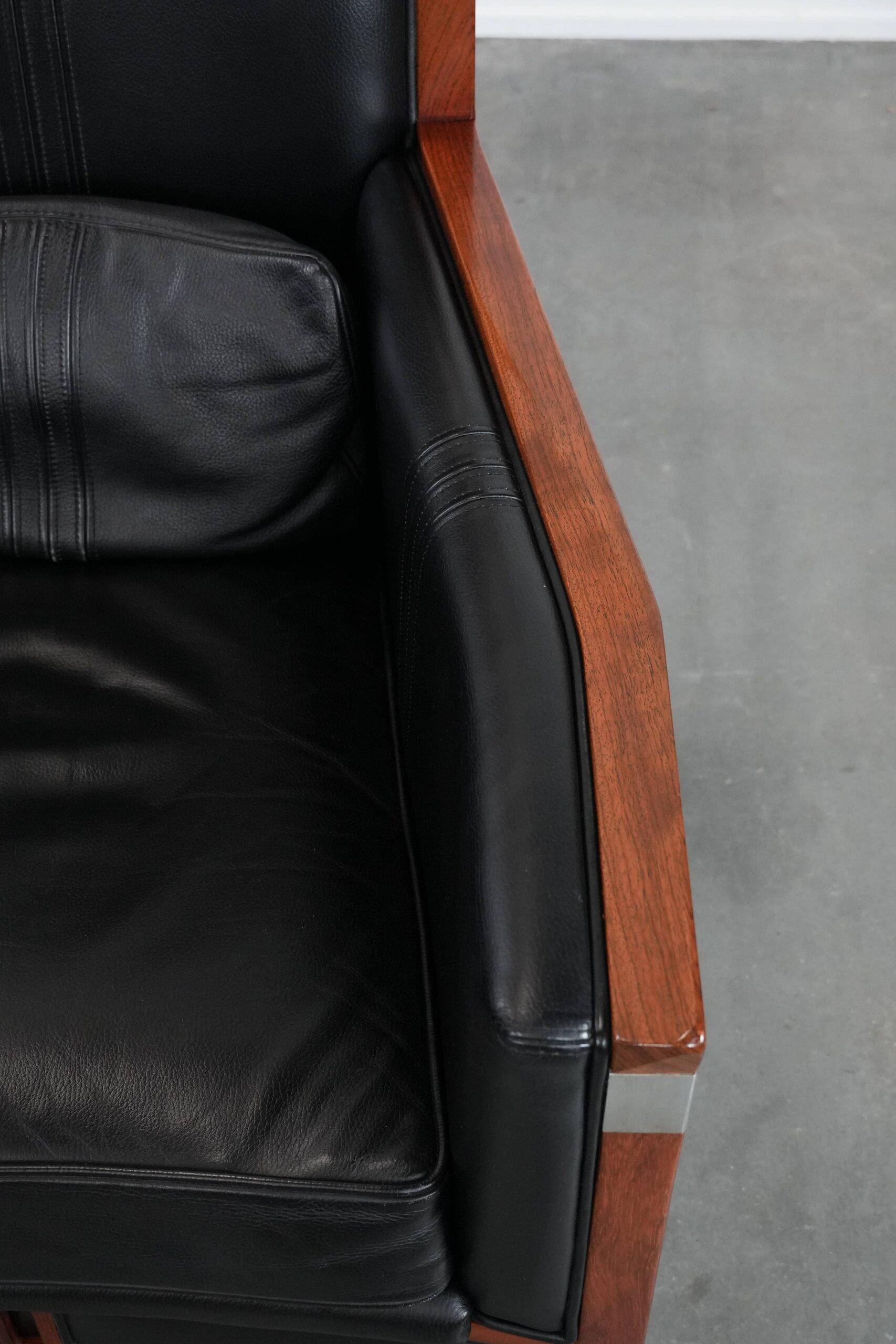 Beautiful and very comfortable black Art Deco design armchair