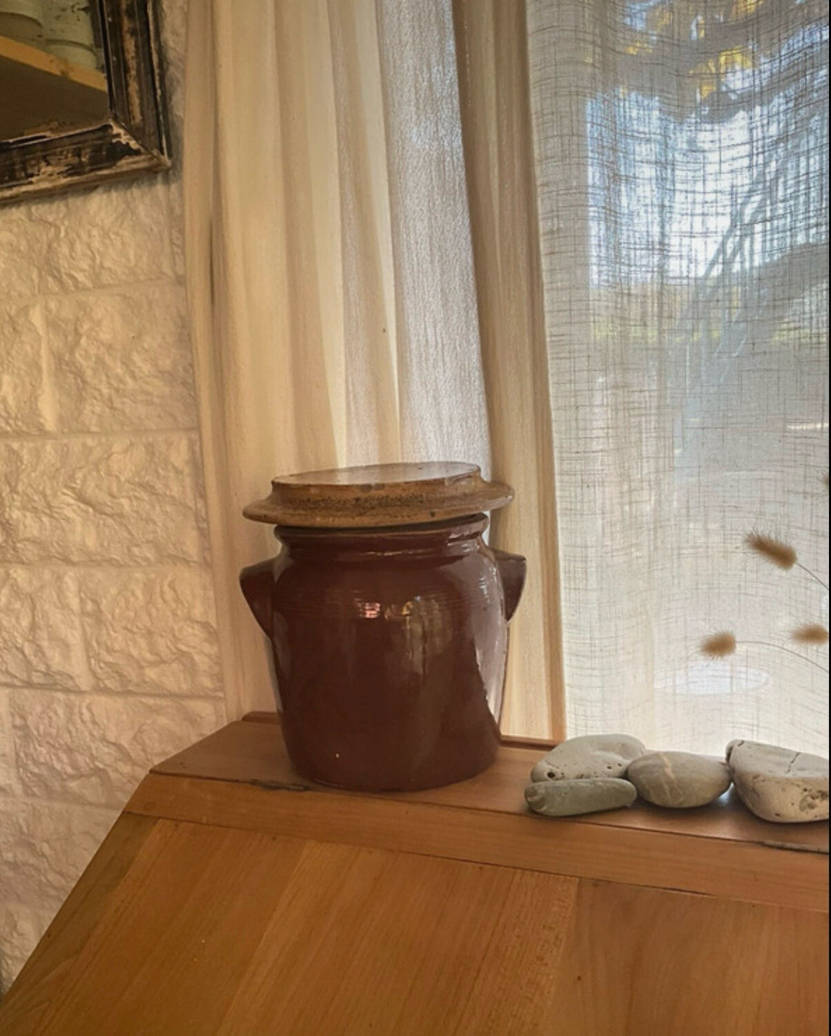 Ancient ceramic salt cellar and its lid.