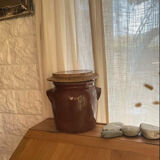 Ancient ceramic salt cellar and its lid.