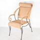 Pair of wicker and blackened iron armchairs