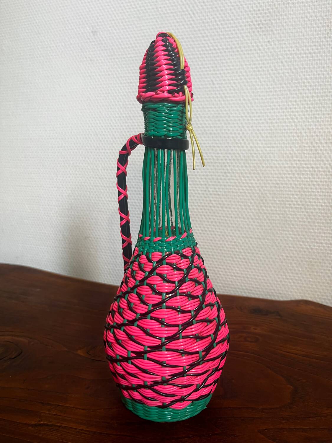 Old glass bottle and scoubidou
