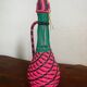 Old glass bottle and scoubidou