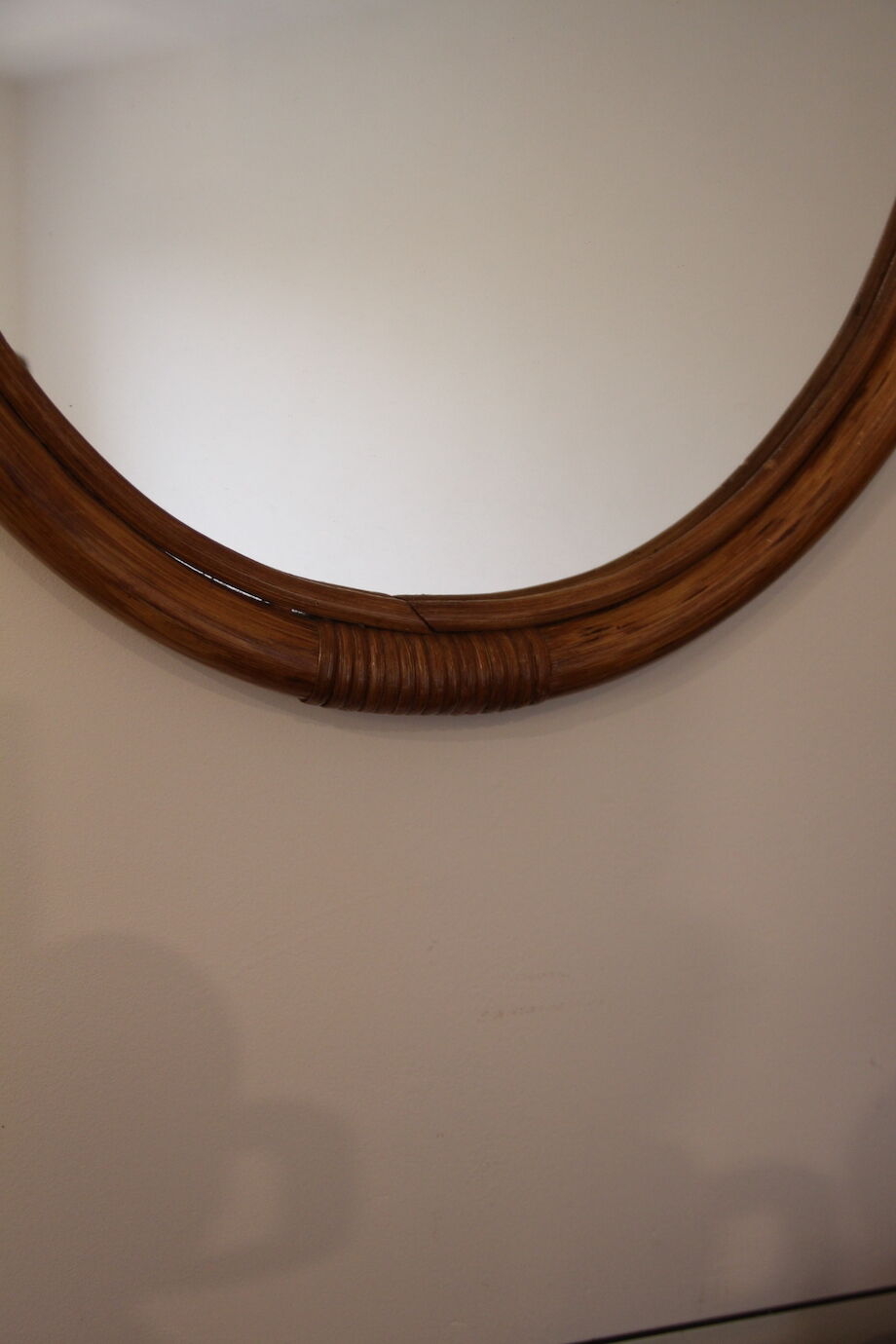 Oval bamboo mirror
