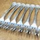 7 Christofle silver-plated oyster forks with Louis crossed ribbons