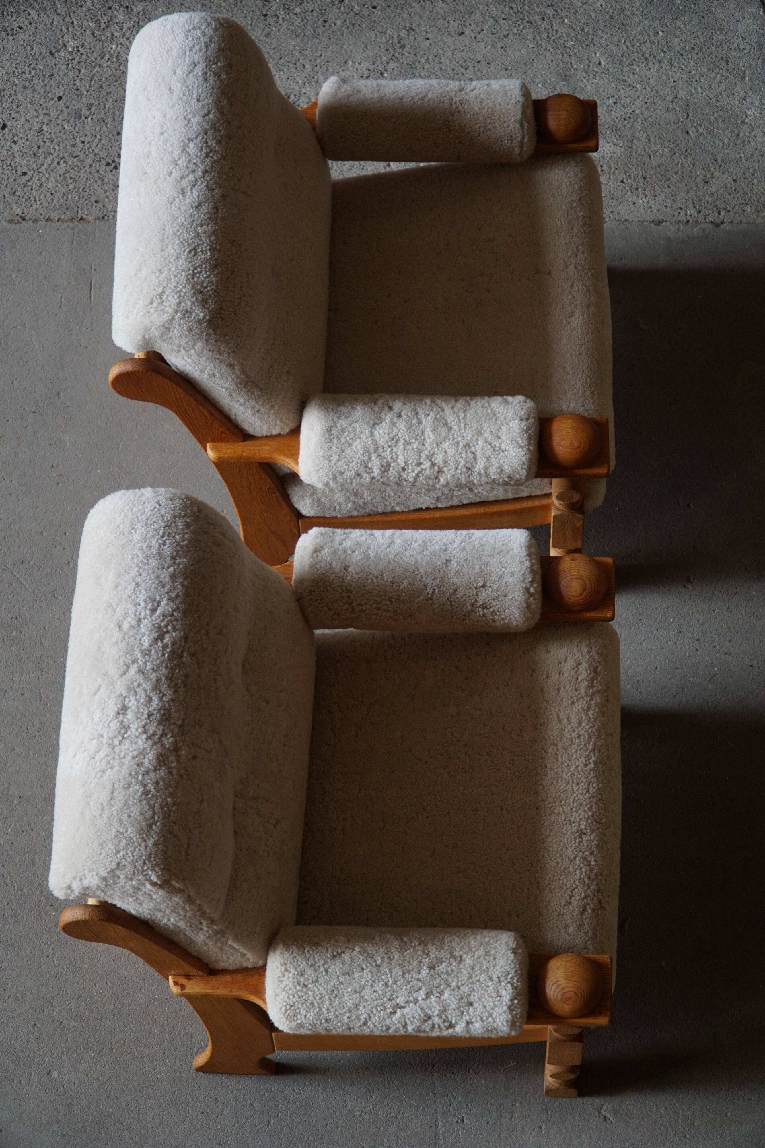 Henning Kjærnulf, lounge chairs in oak and lambswool, mid-century Danish, 1960s.