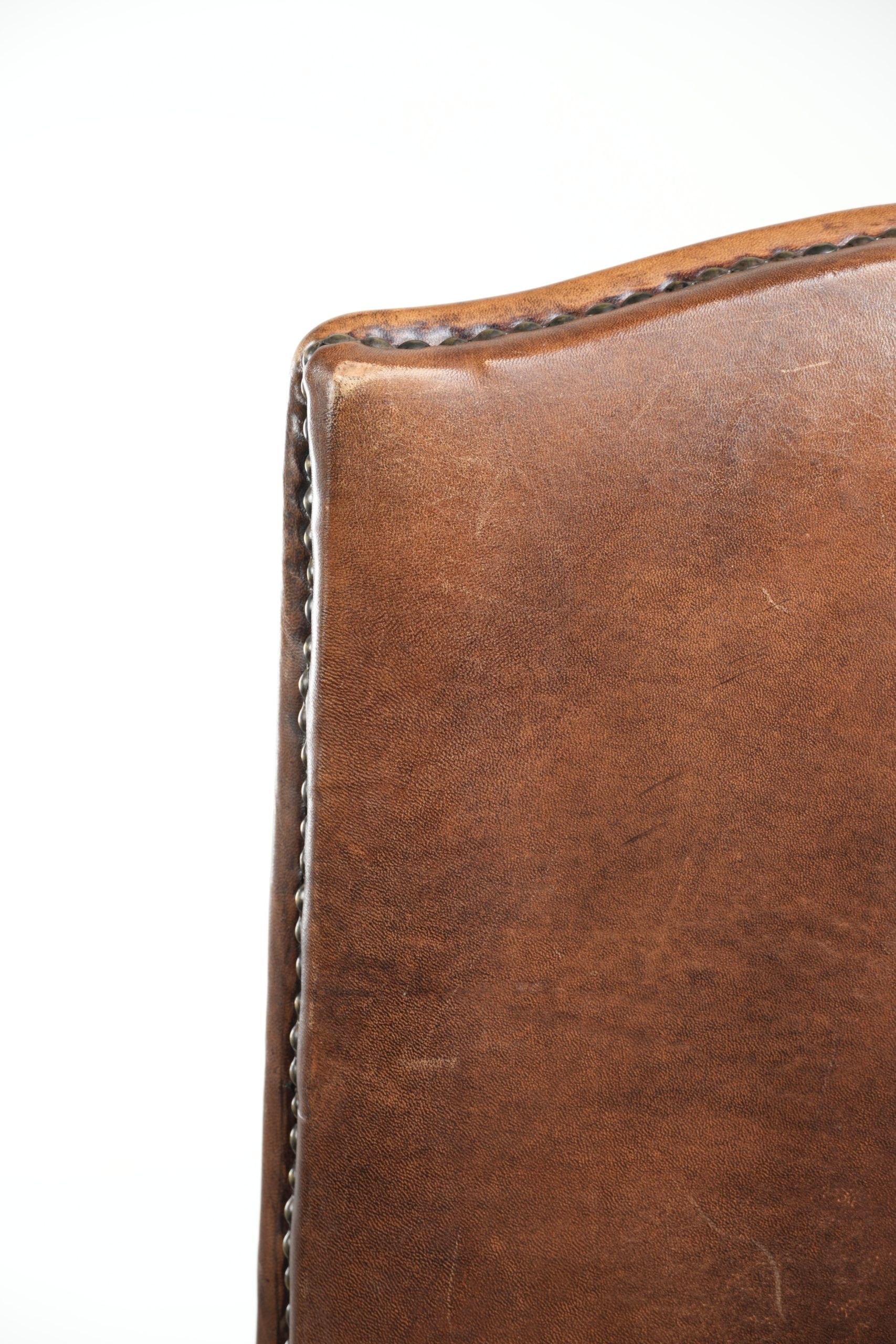 Set of 2 characterful dining chairs of sheepskin leather with a high back