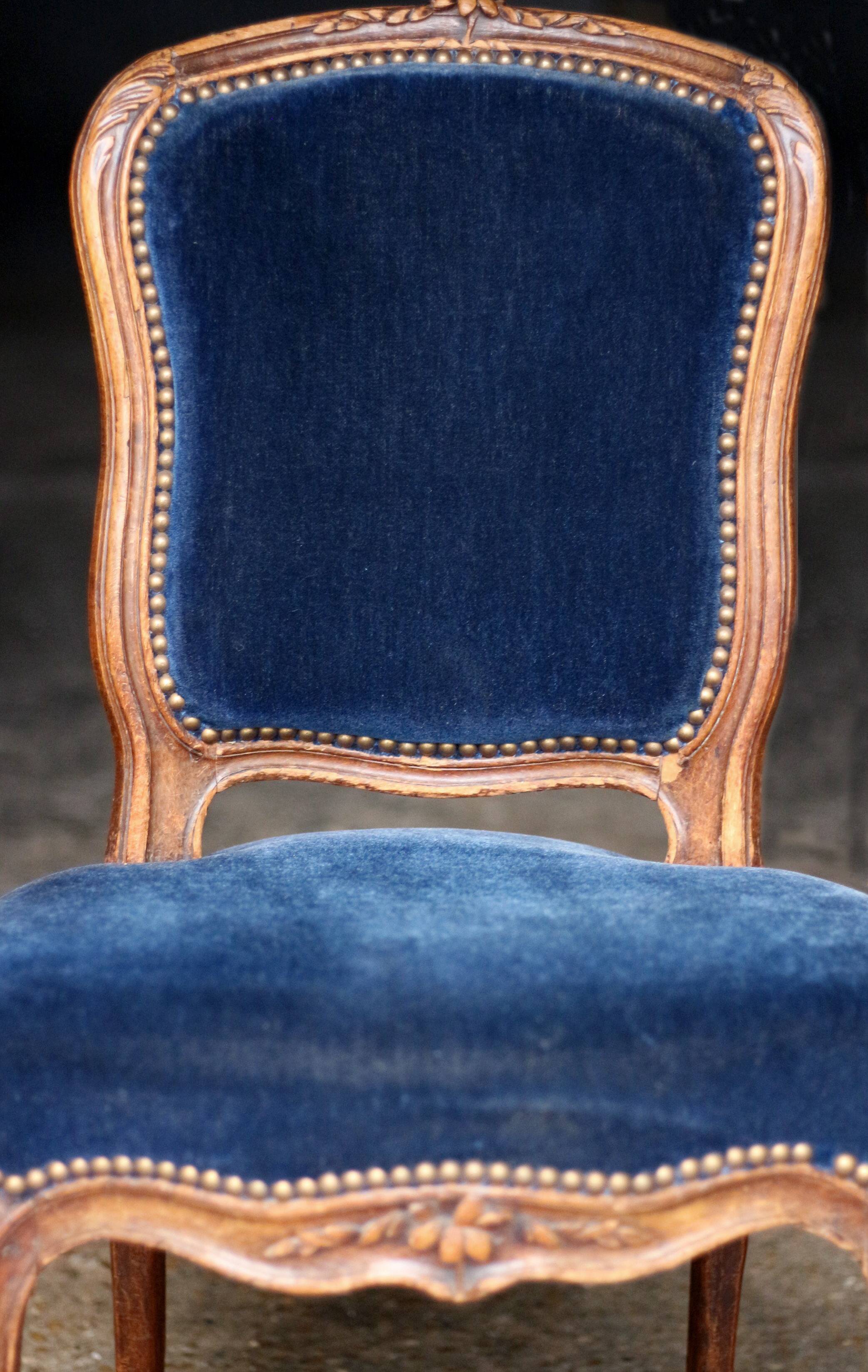 Adorable pair of low chairs from the 19th century. Wood and velvet fabric.