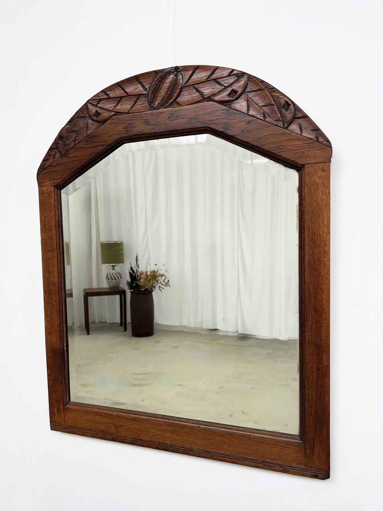 Art Deco oak mirror with carved motif
