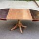 Extendable round dining table with central leg, renovated in raw wood, 20th century