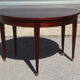 Half-moon console table, extendable in Empire style.