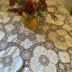 White cotton tablecloth with crochet lace.