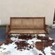 Cane-seated teak bench