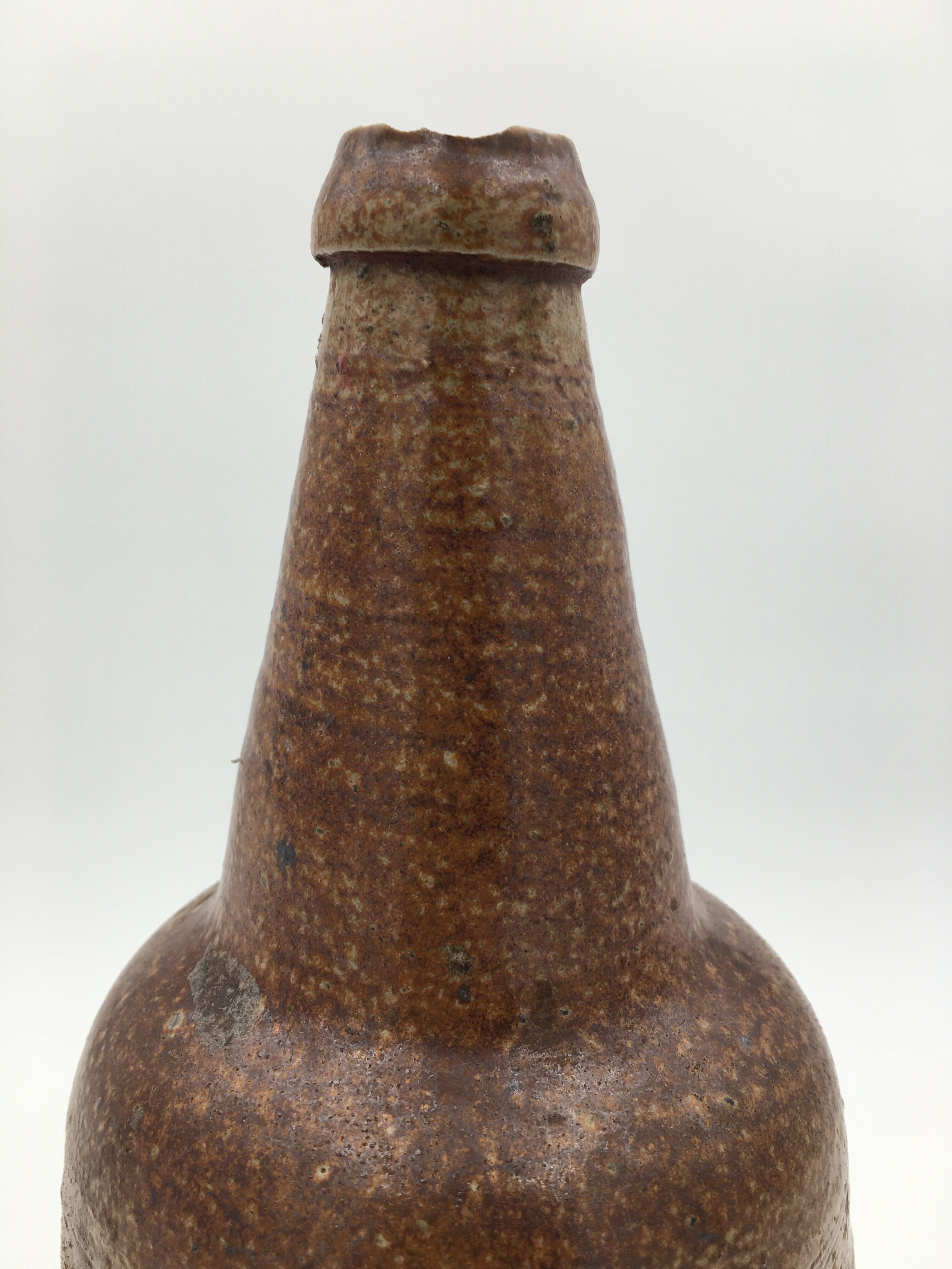 Old glazed terracotta bottle, early 20th century