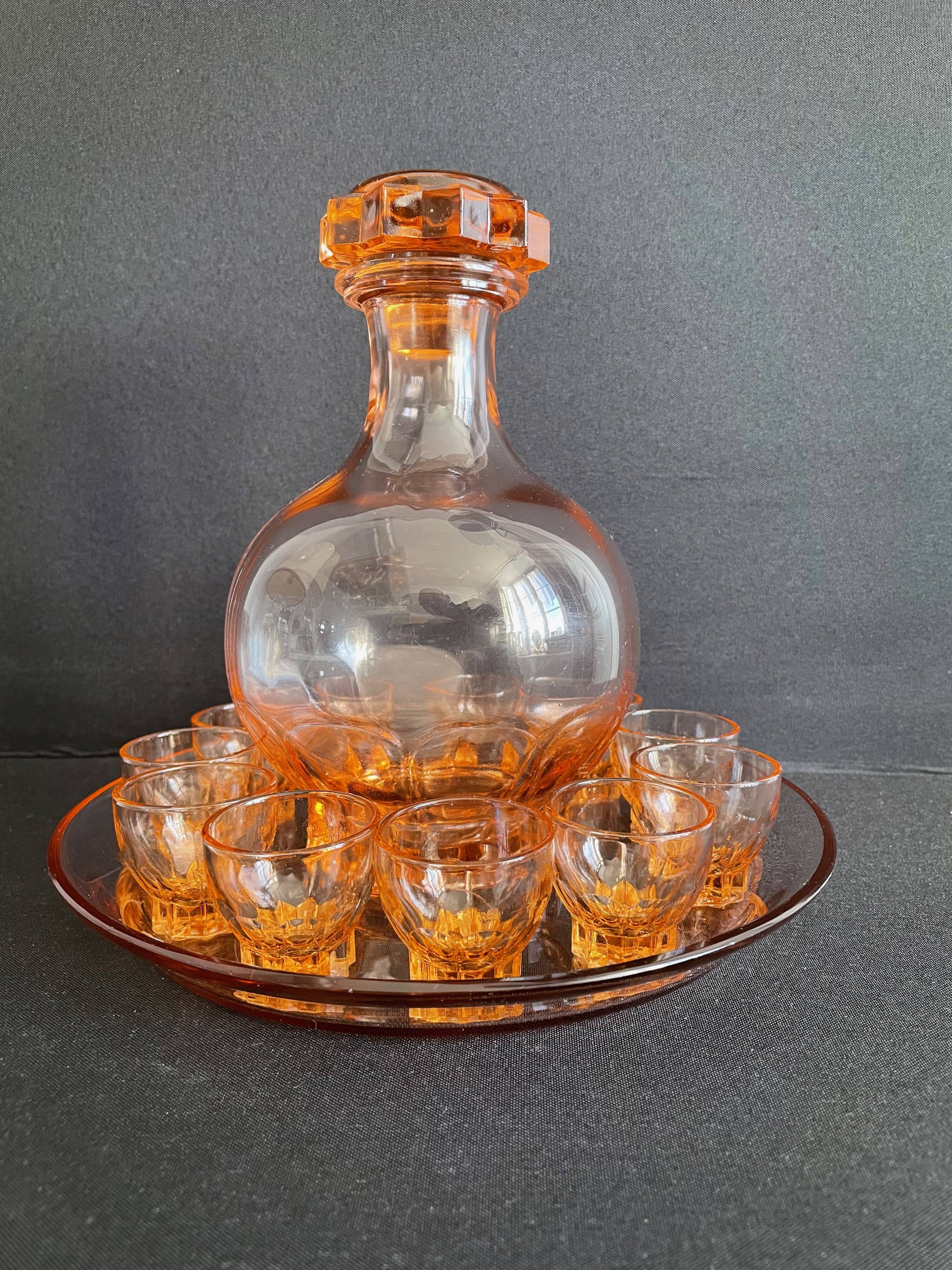 Liquor service in pink moulded glass