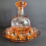 Liquor service in pink moulded glass