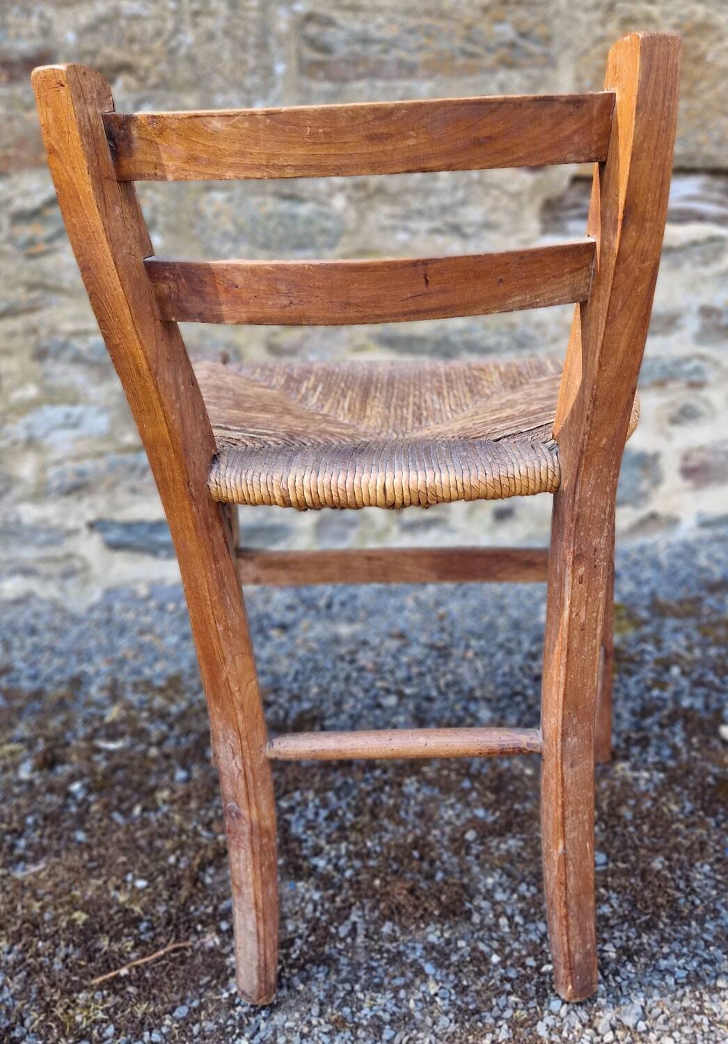 Antique straw chair with low back