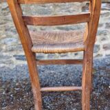 Antique straw chair with low back
