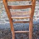 Antique straw chair with low back