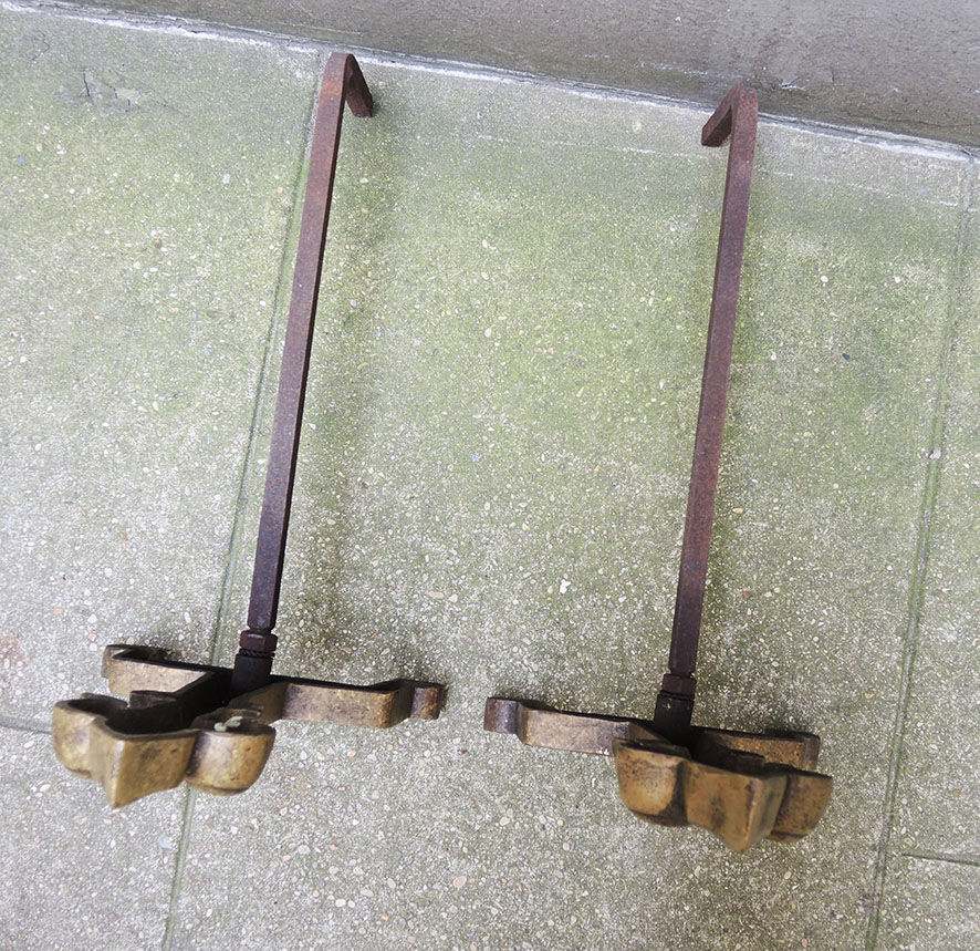 Old brass chenets & fleur de lys cast iron