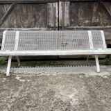 Old perforated metal garden bench