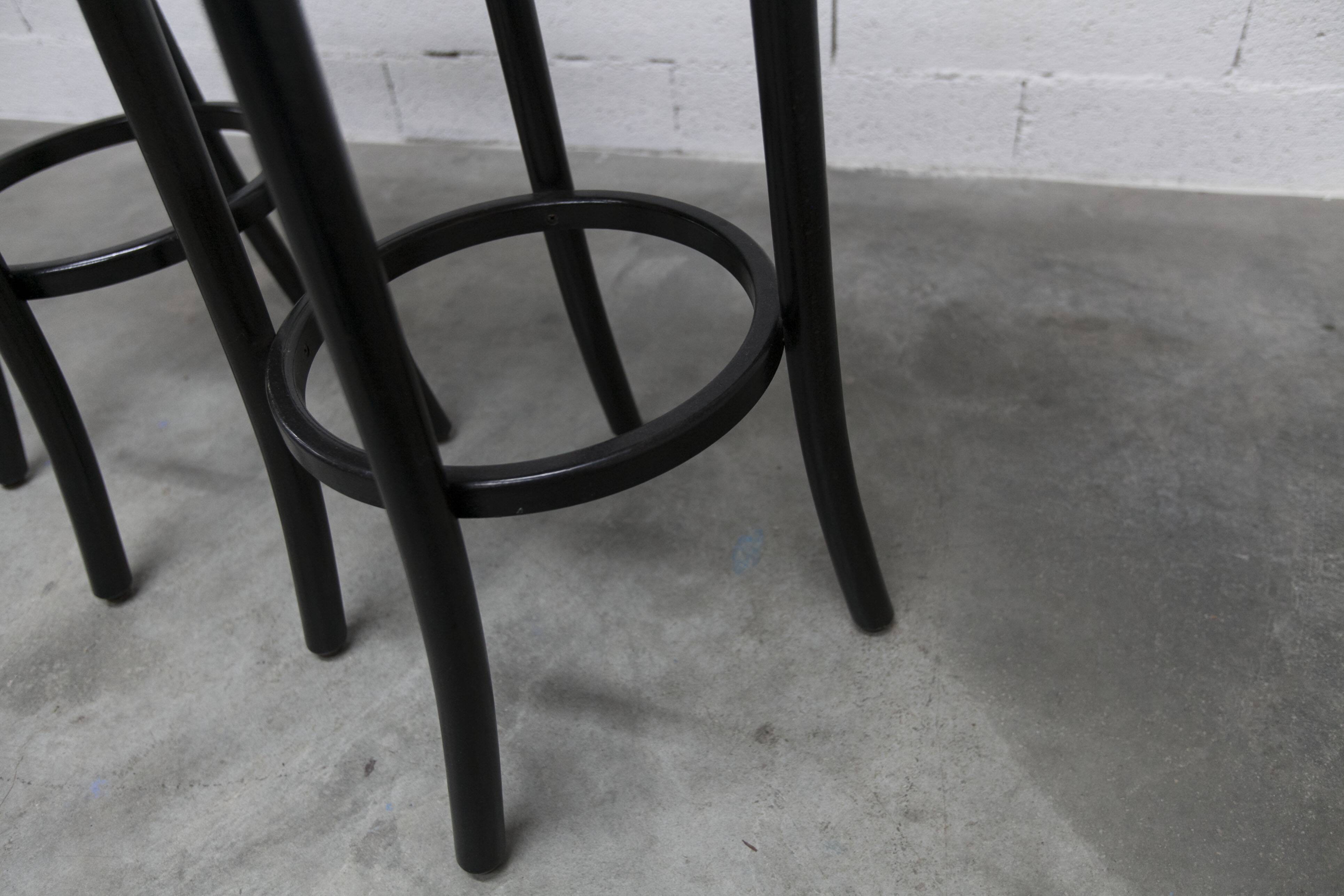 Pair of Baumann Dialog model stools in black and yellow and blue imitation leather, 1990
