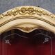 Curved display cabinet in Louis XV style, in cream lacquered wood enhanced with gilding.