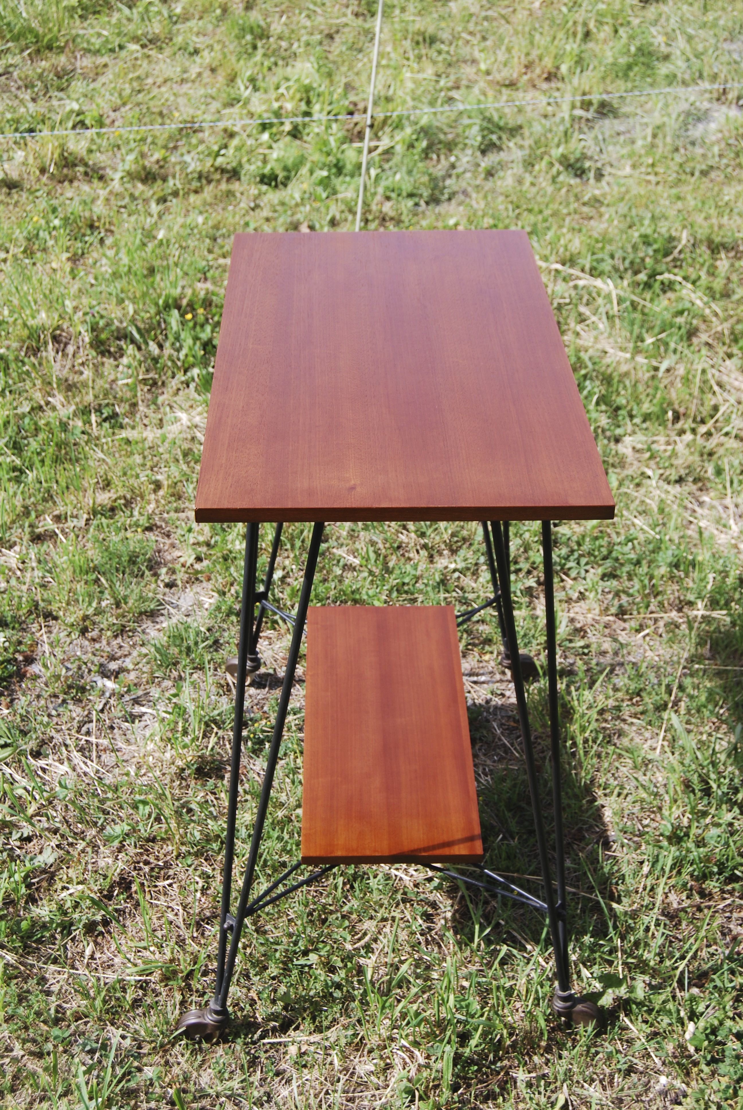 Tv furniture, a table with teak wheels and Scandinavian-style metal.
