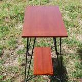 Tv furniture, a table with teak wheels and Scandinavian-style metal.