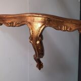 Corner console in gilded wood