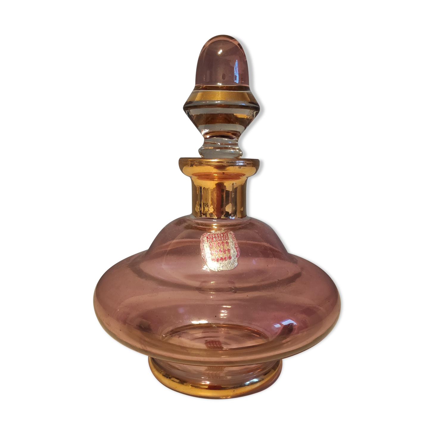 Pink and gold glass carafe stamped "Monaco glassware"