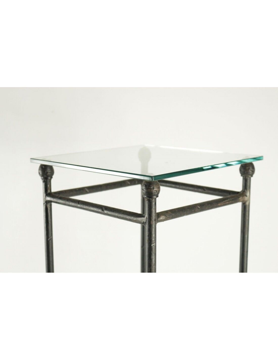 Two consoles, wrought iron sheaths on glass top, twentieth century