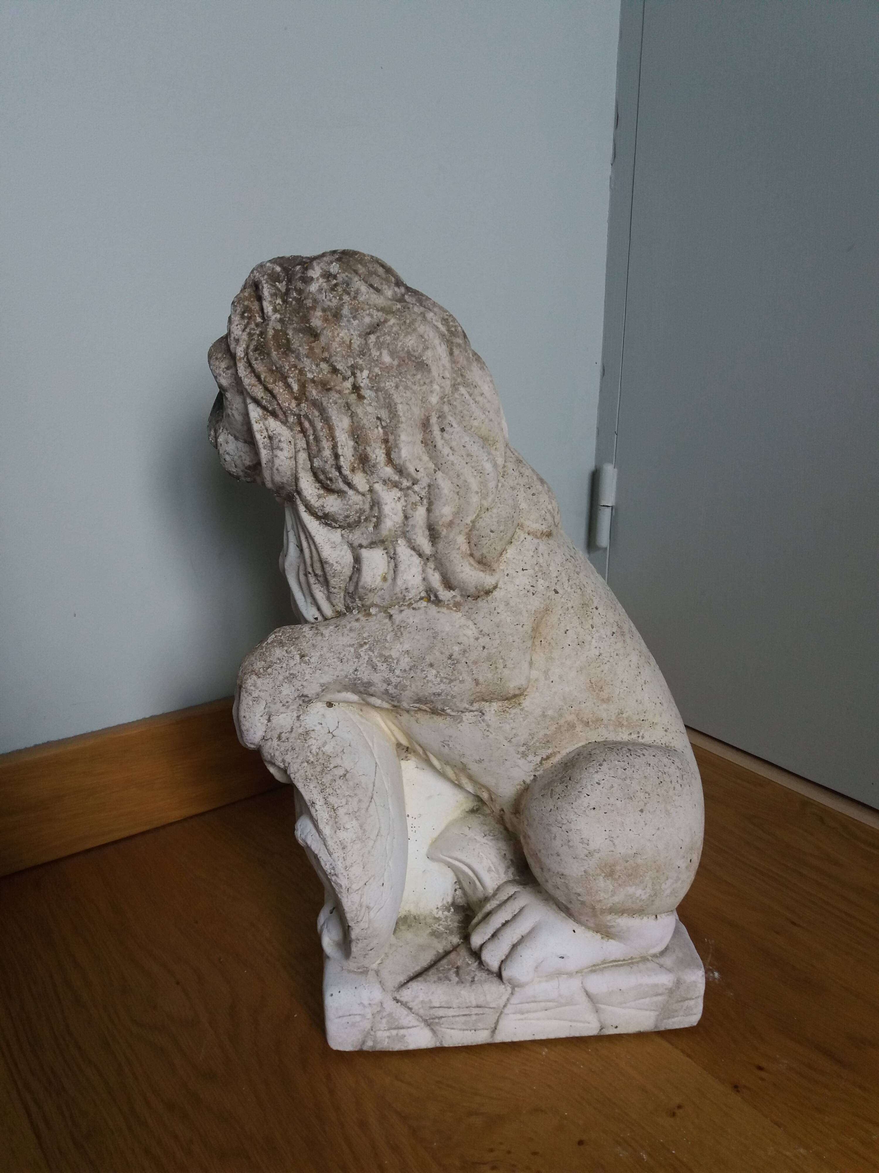 Lion garden statue in reconstituted stone