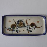 Sandstone cake dish with a fish decoration