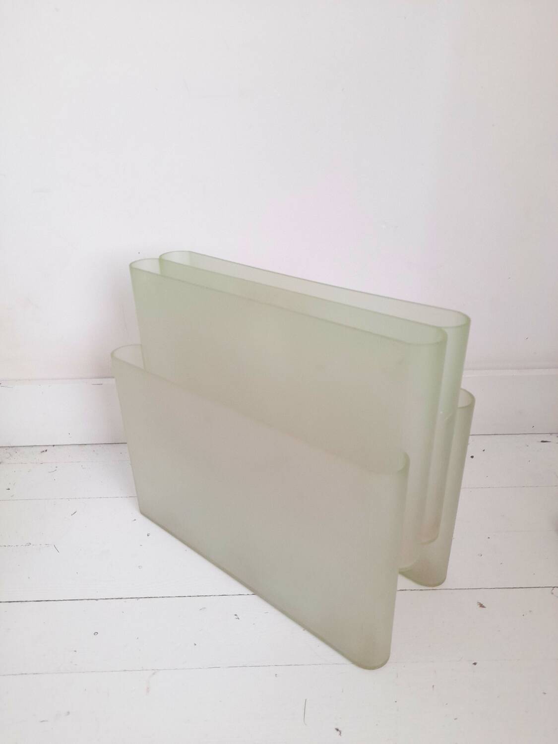 Stoppino magazine rack by Kartell