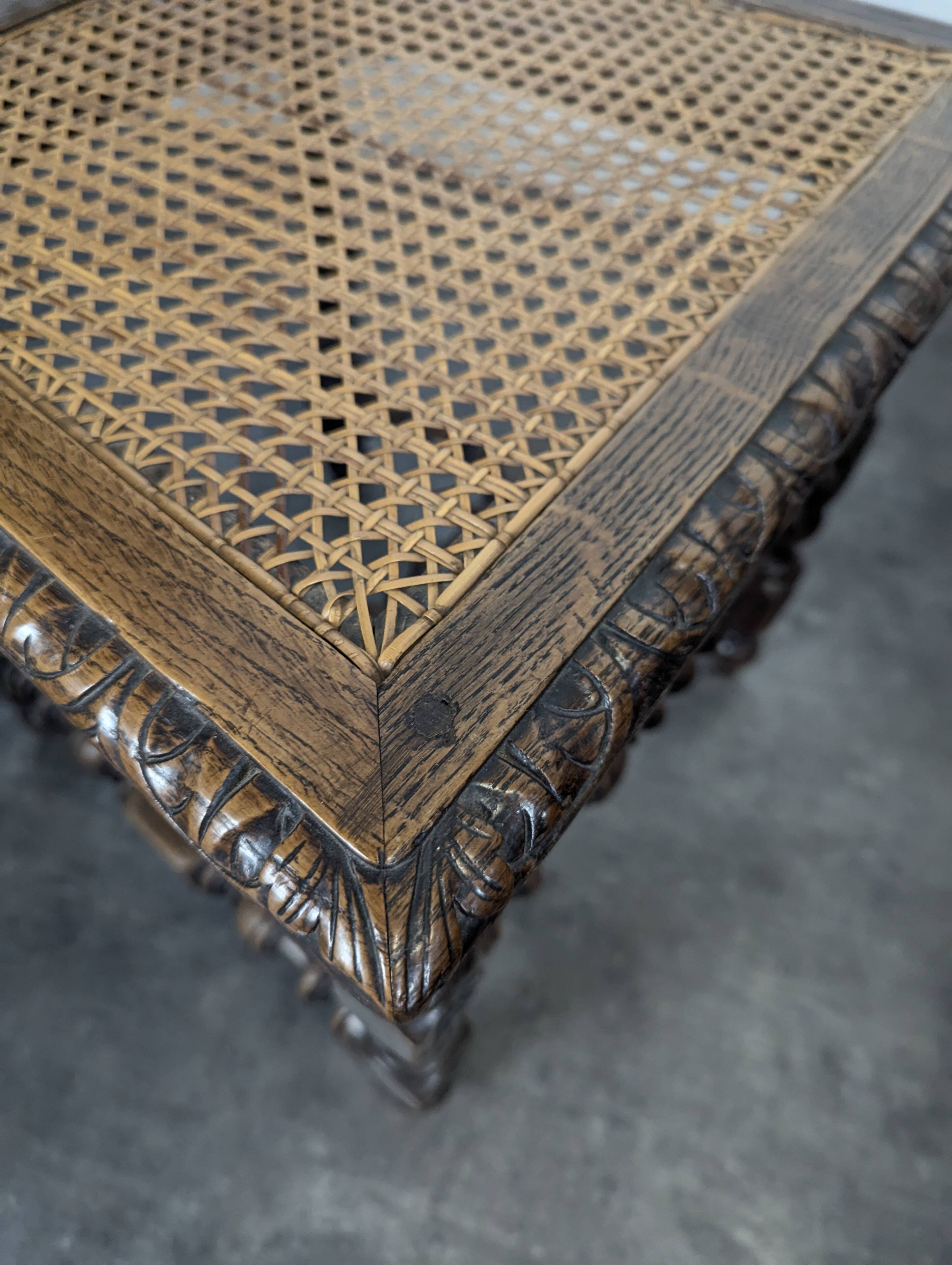 Set of 6 Henri II chairs in carved openwork oak with caned seats.