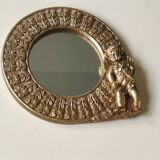 Shabby Chic round mirror. Putti/Cherub decor. Floral motifs. Dimensions: 20 x 20 cm.