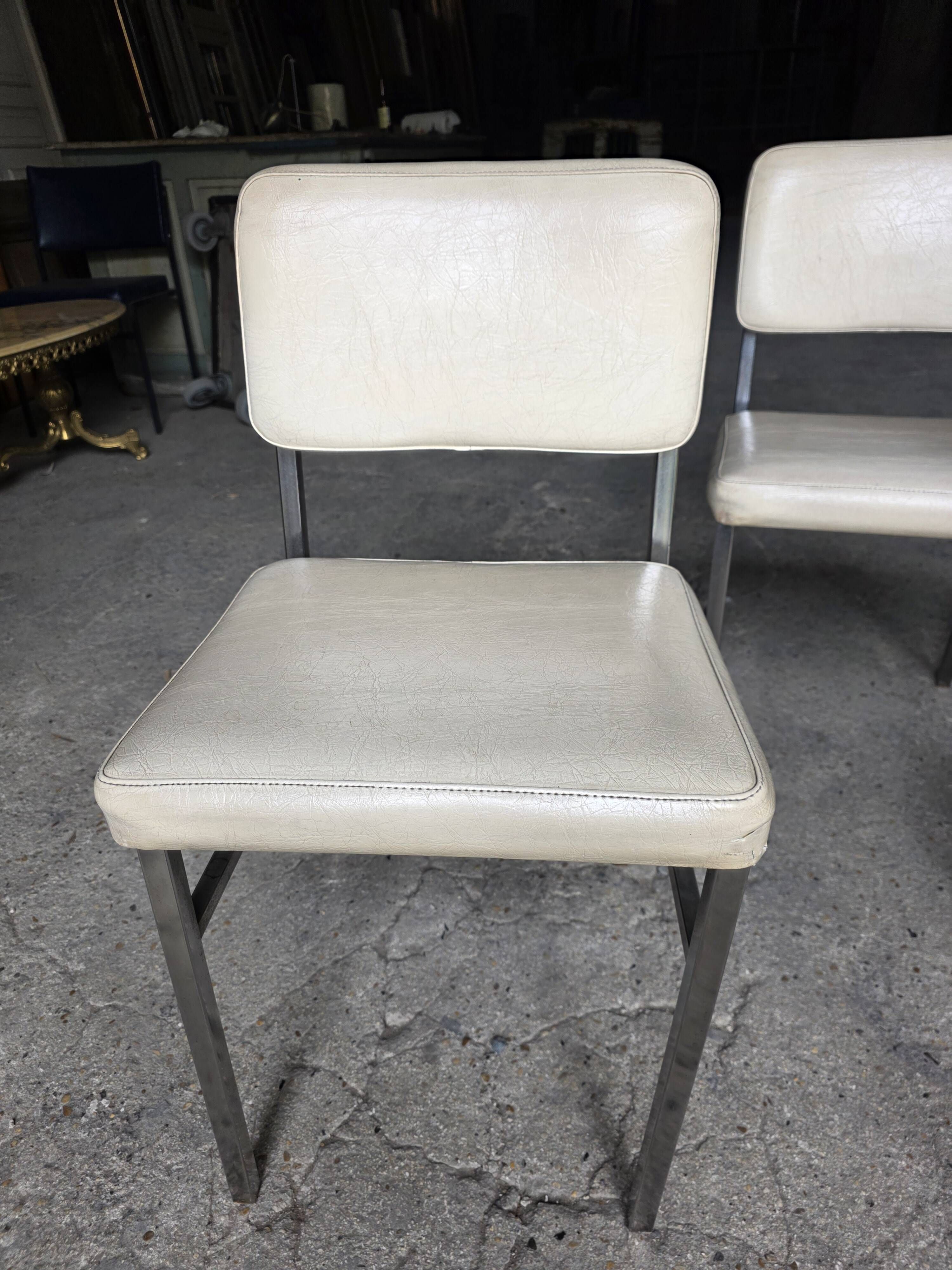 4 chrome metal chairs with faux leather from the 1970s.