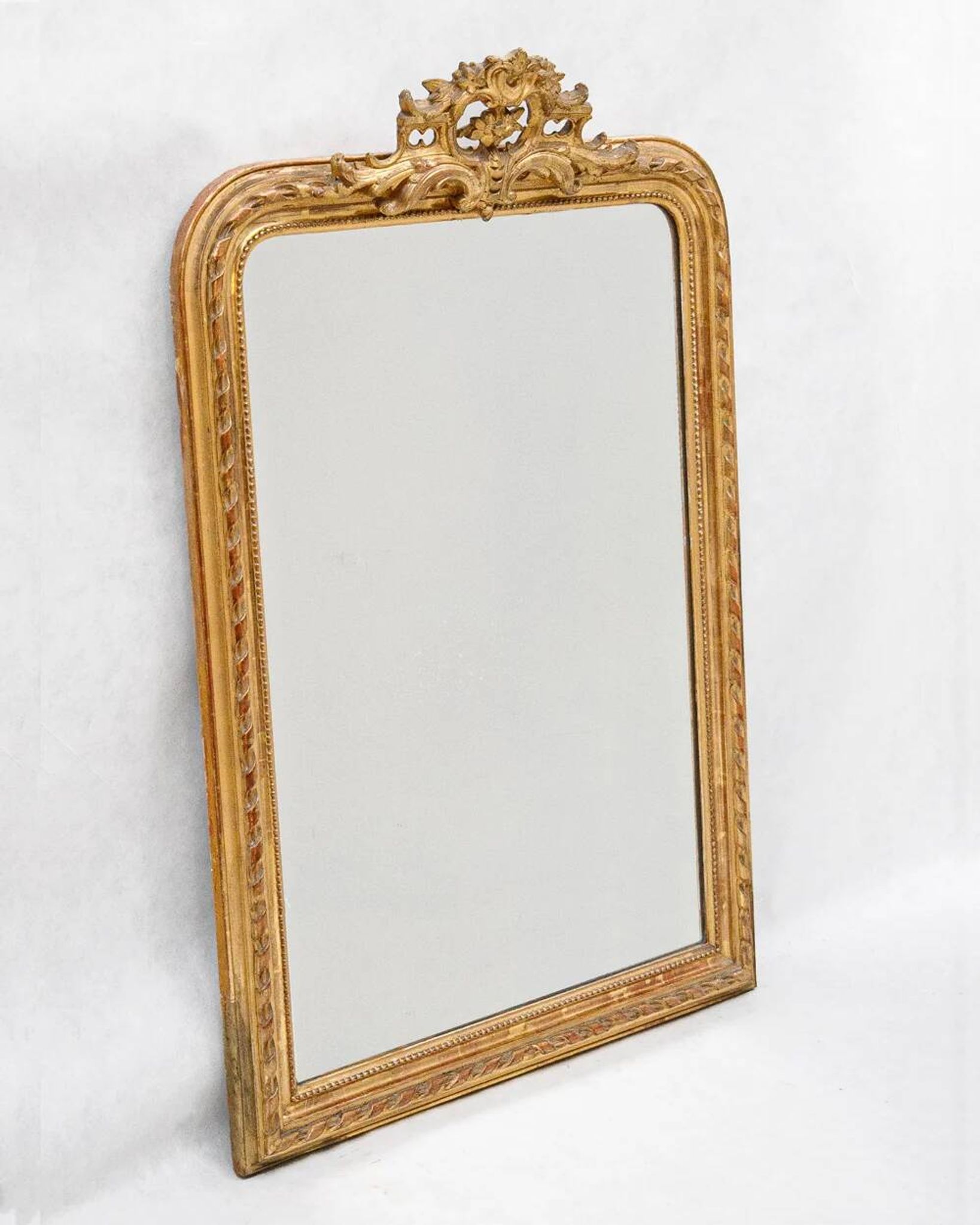 Louis-Philippe mirror from the 19th century with a ribbon trompe-l'œil frame.