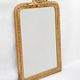 Louis-Philippe mirror from the 19th century with a ribbon trompe-l'œil frame.