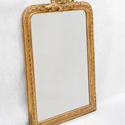 Louis-Philippe mirror from the 19th century with a ribbon trompe-l'œil frame.