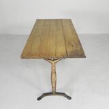 Art Deco bistro table with oak top on cast iron table