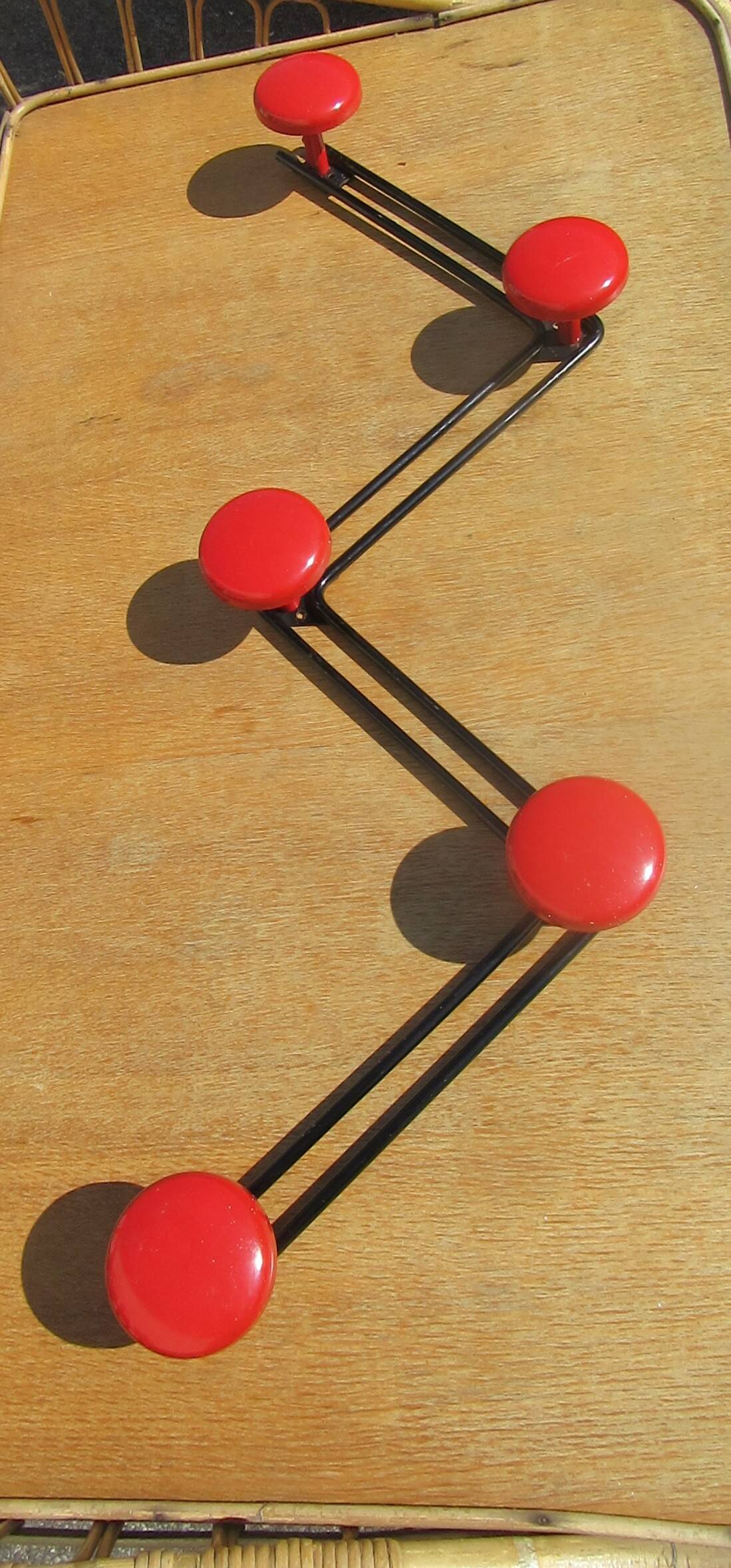 vintage black and red iron coat rack