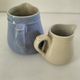 Duo of pastel ceramic milk jugs – Lavender blue & vintage cream