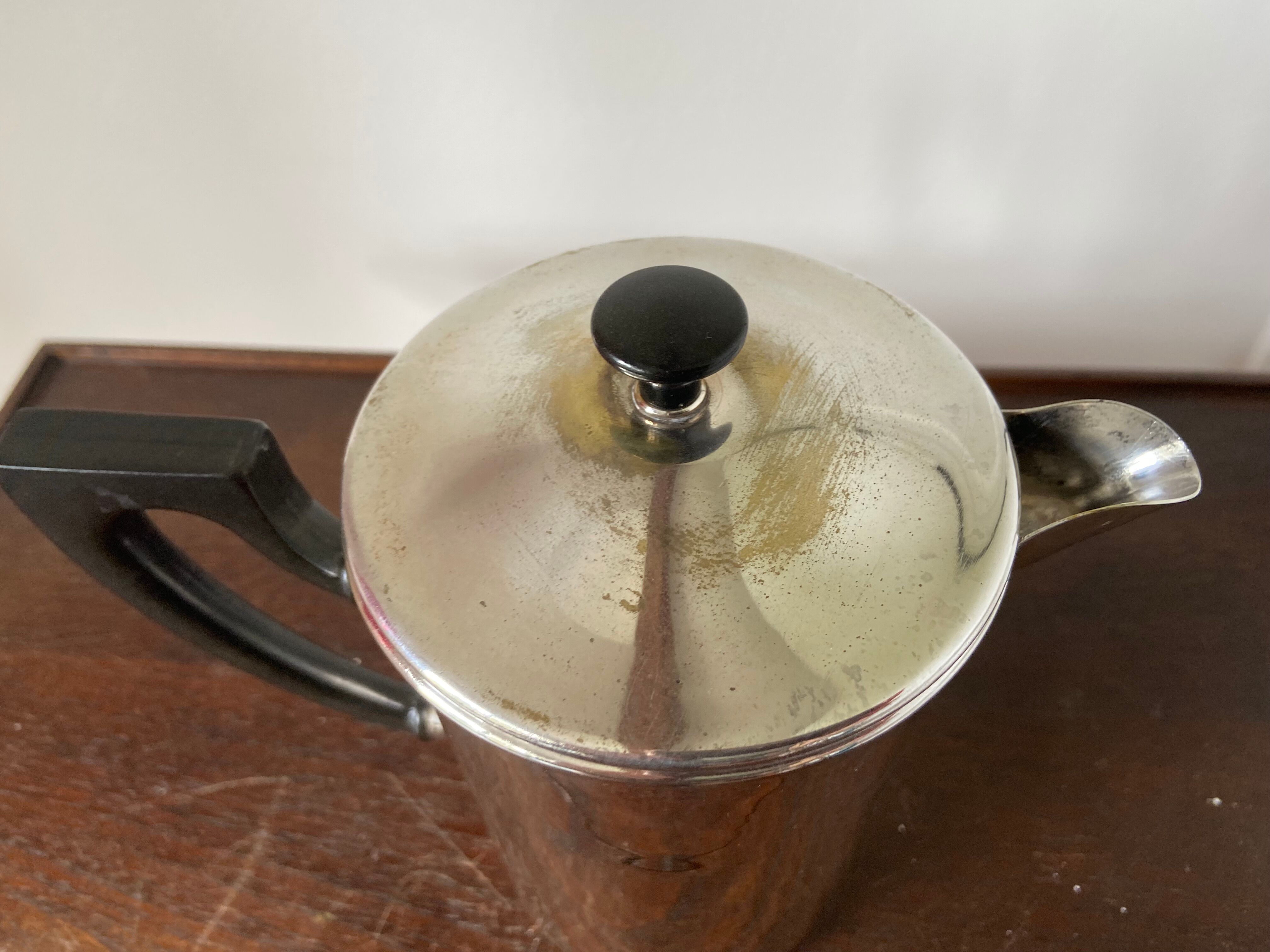 Old silver metal piston coffee maker