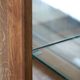 Antique Dutch oak display cabinet with glass shelves and a mirrored back