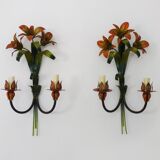 Large pair of vintage sconces in painted metal in the shape of a fleur-de-lis and foliage. 1970s