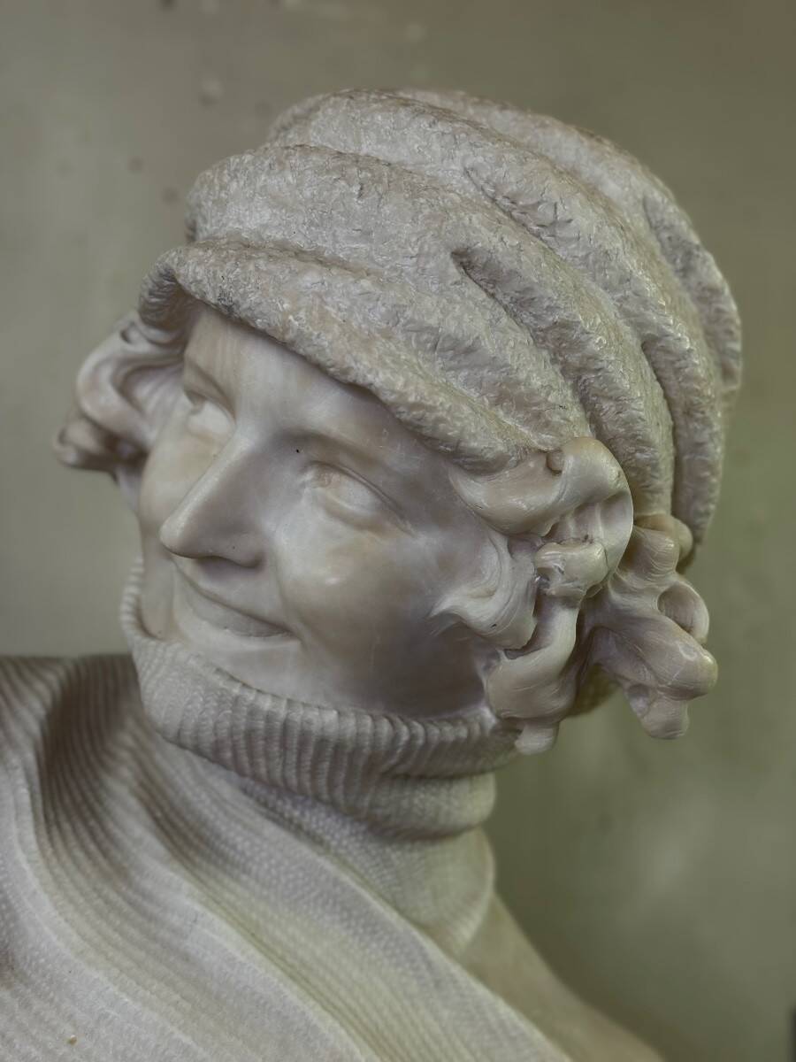 Alabaster bust of a young girl with a turtleneck, signed Caloni, Italy circa 1900