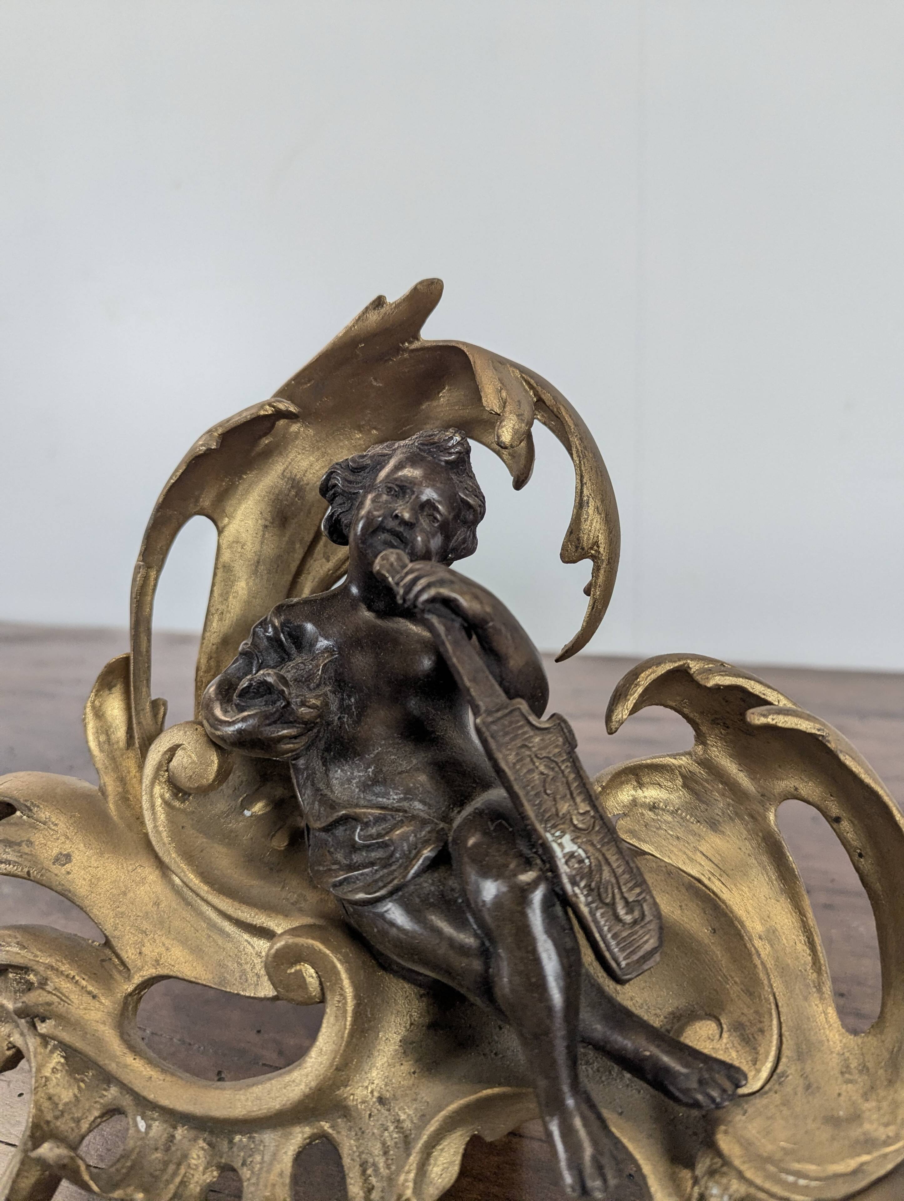 Pair of bronze fire dogs in the Louis XV style