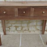 Console in solid walnut with a natural finish, featuring three drawers with a belt.